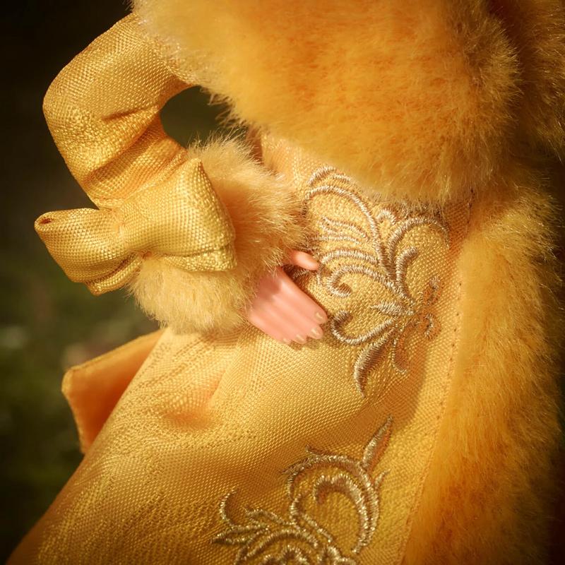 Guo Pei Barbie® Doll Wearing Golden-Yellow Gown (2022)